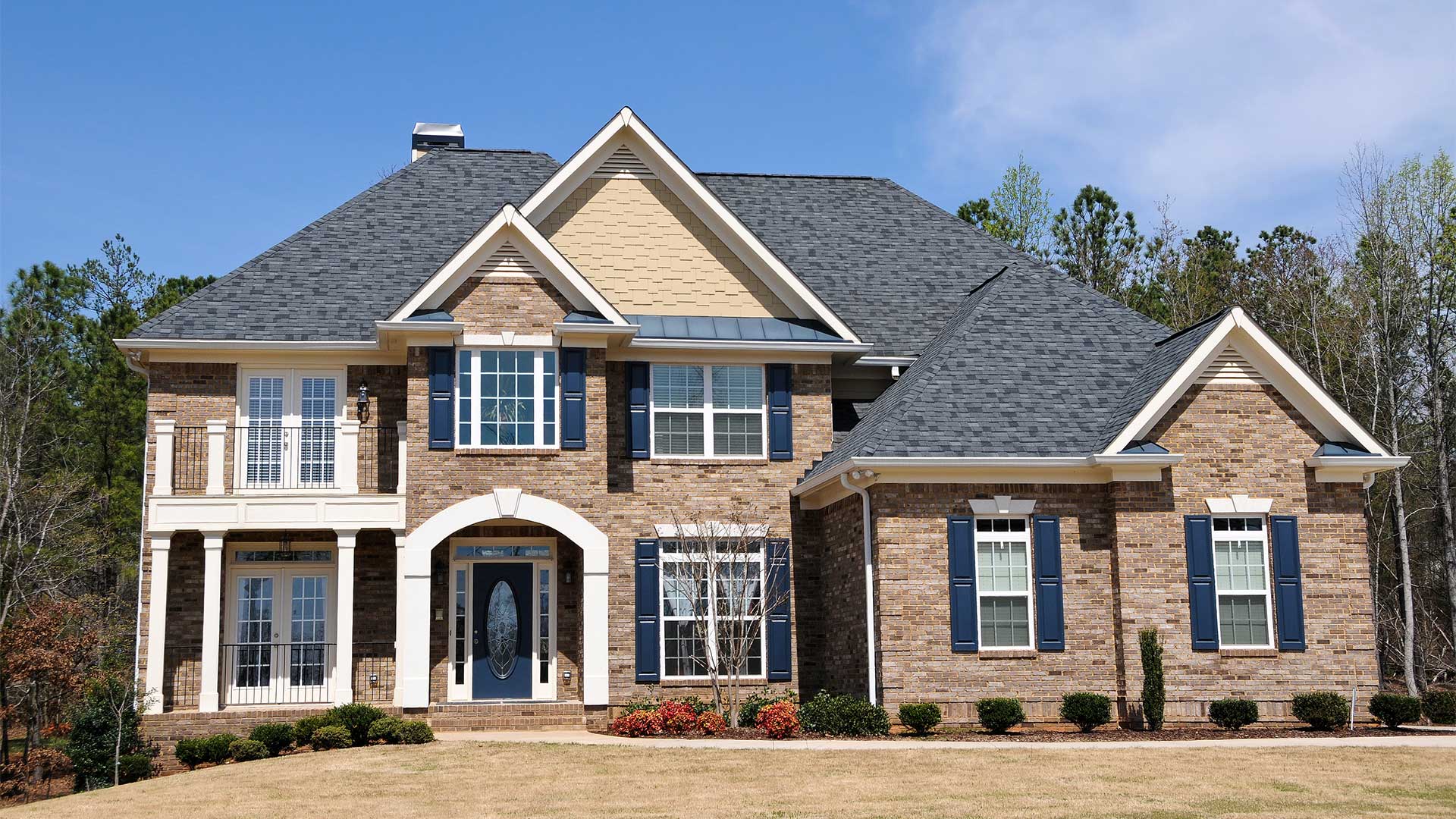 replacement windows in a two story brick home
